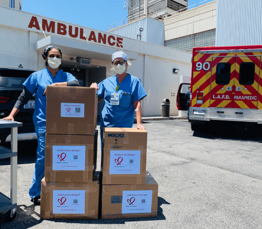 Hospital workers receiving boxes of PPE equipment